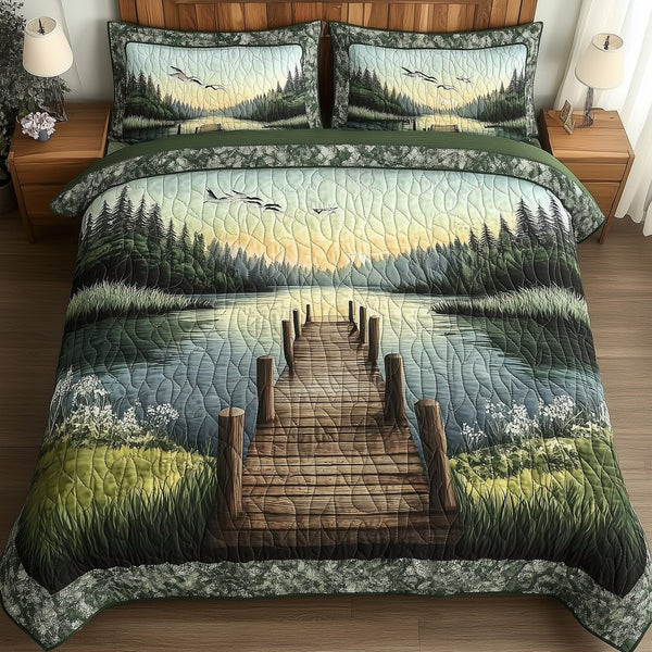 The Dock to Dawn quilted 3-piece bedding set on a made bed with two matching pillow shams