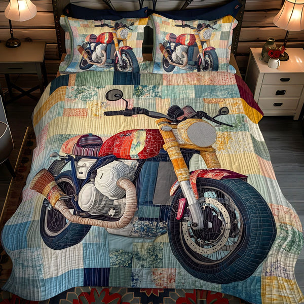 The Endless Ride quilted 3-piece bedding set on a made bed with two matching pillow shams