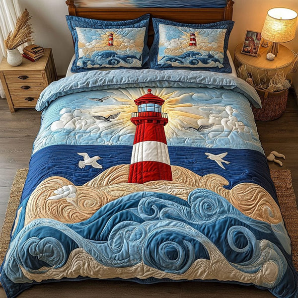 The Lighthouse Glow quilted 3-piece bedding set on a made bed in a light coastal bedroom
