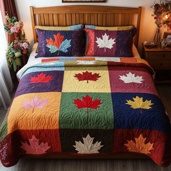 The Maple Whisper quilted 3-piece bedding set on a made bed with two matching pillow shams