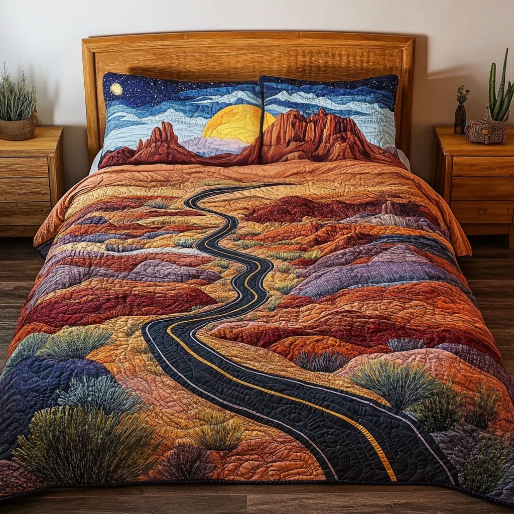 The Nevada Trail quilted 3-piece bedding set on a made bed with two matching pillow shams
