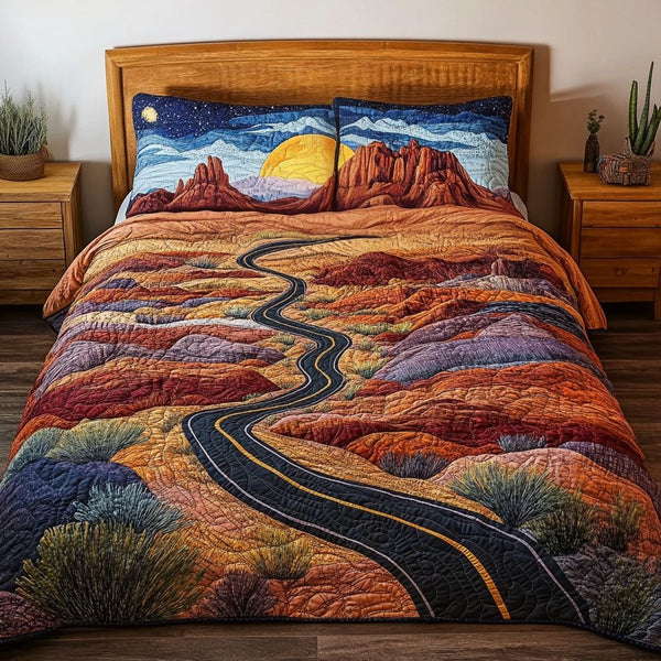 The Nevada Trail quilted 3-piece bedding set on a made bed with two matching pillow shams