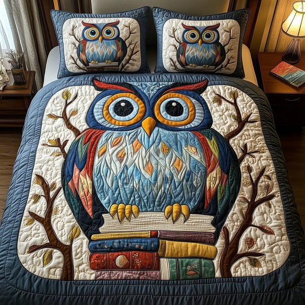 The Owlchemy quilted 3-piece bedding set on a made bed with two matching pillow shams