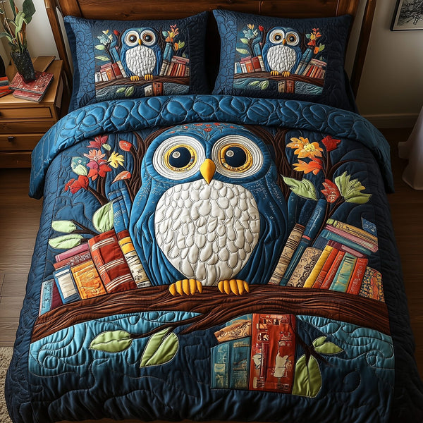 The Owlchemy quilted 3-piece bedding set on a made bed with two matching pillow shams