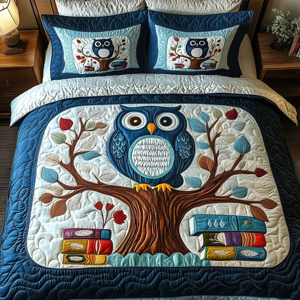 The Owlchemy quilted 3-piece bedding set on a made bed with two matching pillow shams