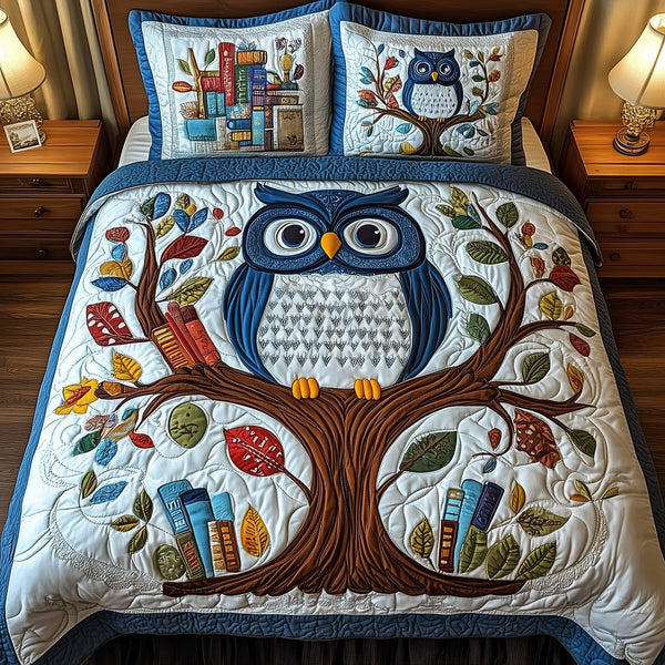 The Owlchemy quilted 3-piece bedding set on a made bed with two matching pillow shams