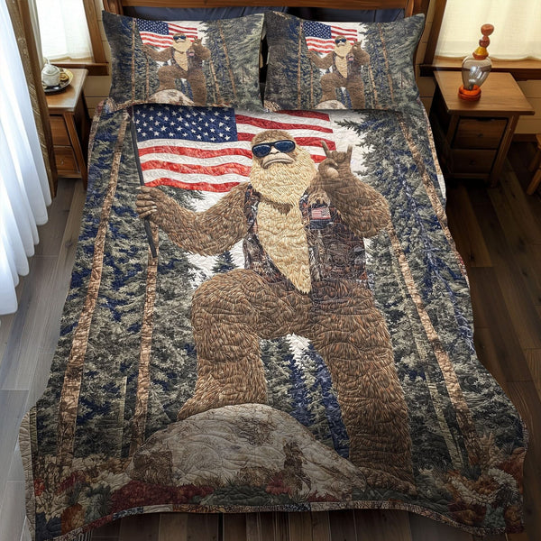 The Patriotic Footprint quilted 3-piece bedding set on a made bed in a warmly lit bedroom