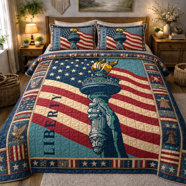 The Torch of Liberty quilted 3-piece bedding set on a made bed in a warmly lit bedroom
