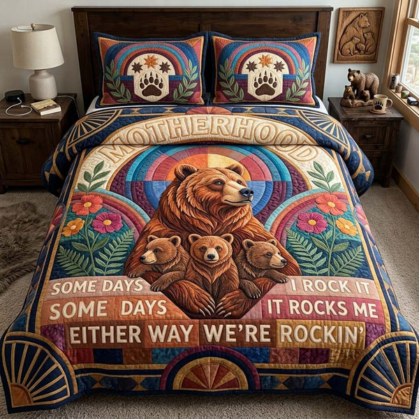 The Unshaken Matriarch quilted 3-piece bedding set on a made bed with two matching pillow shams