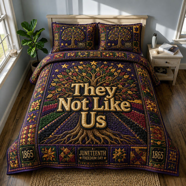 They Not Like Us Freedom Tree Juneteenth quilted 3-piece bedding set on a made bed in a warmly lit bedroom