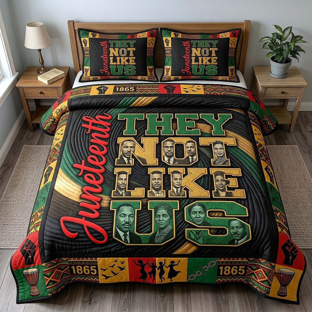 They Not Like Us quilted 3-piece bedding set on a made bed with two matching pillow shams