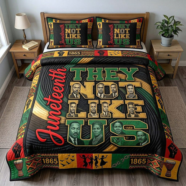 They Not Like Us quilted 3-piece bedding set on a made bed with two matching pillow shams