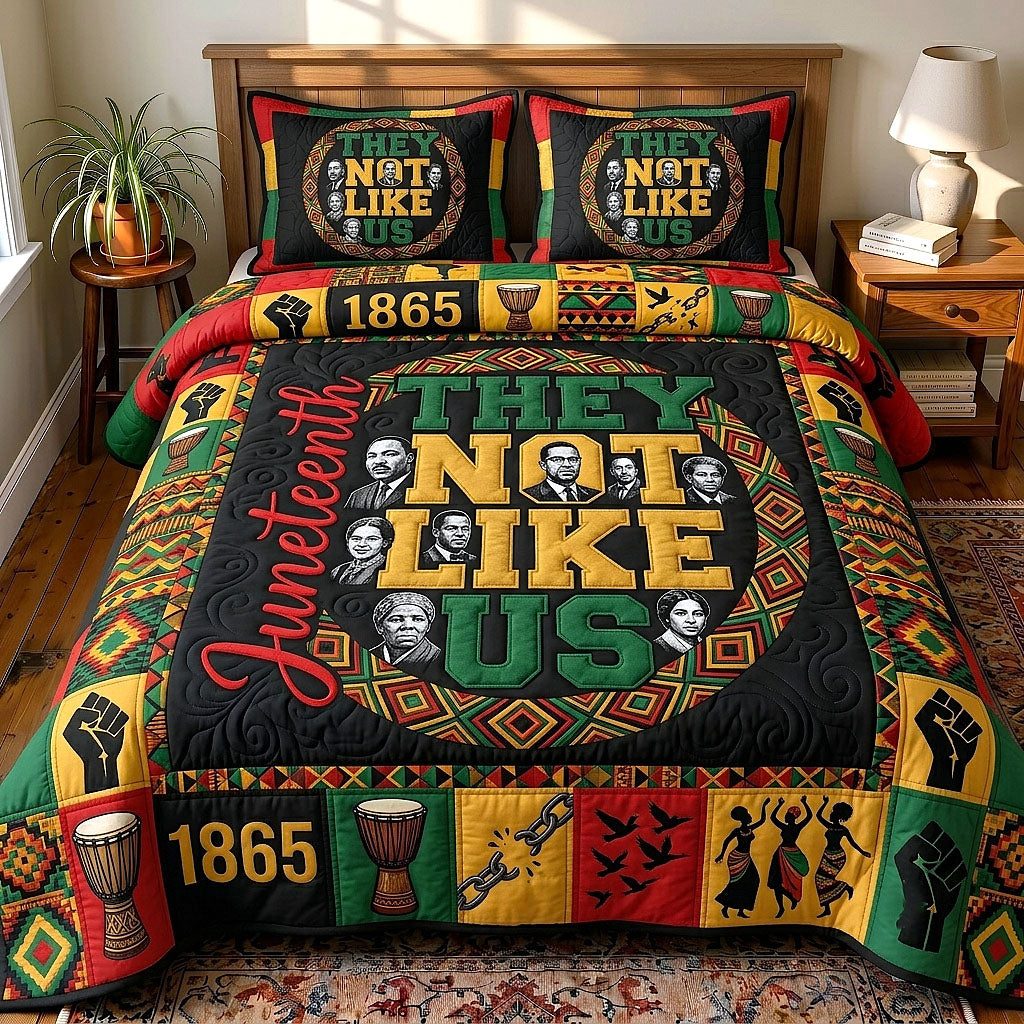 They Not Like Us quilted 3-piece bedding set on a made bed with two matching pillow shams
