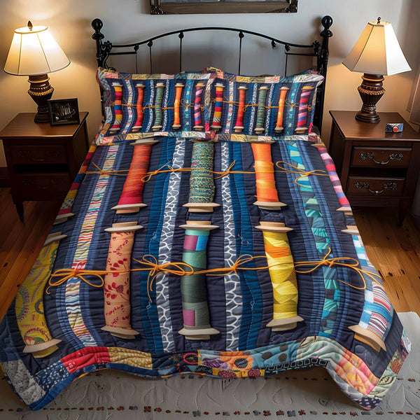 Threaded Beauty quilted 3-piece bedding set on a made bed with two matching pillow shams