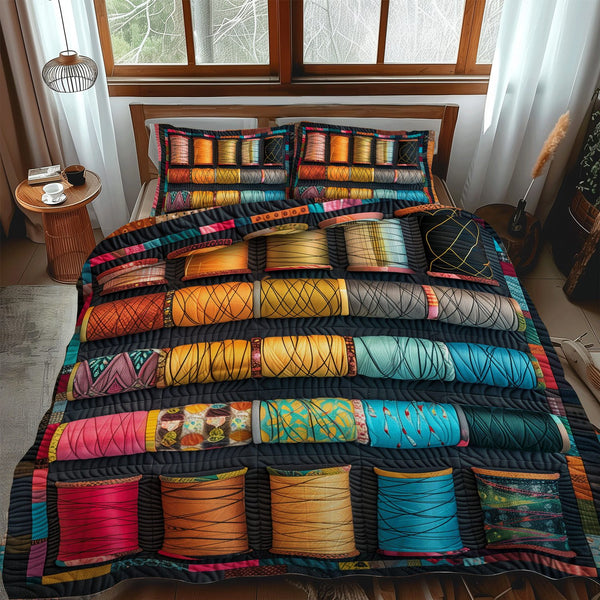 Threads of Joy quilted 3-piece bedding set on a made bed with two matching pillow shams