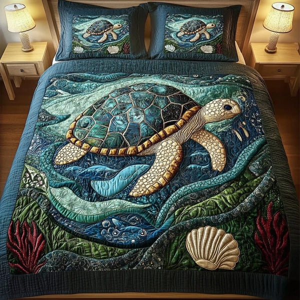 Tidal Grace quilted 3-piece bedding set on a made bed with two matching pillow shams
