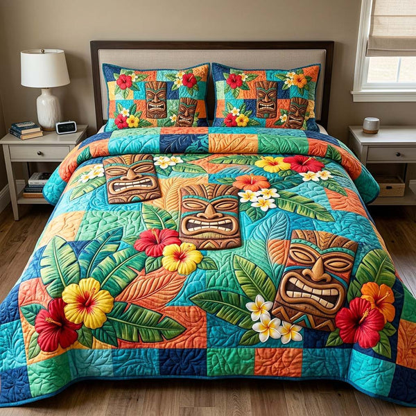 Tiki Bloom quilted 3-piece bedding set on a made bed with two matching pillow shams