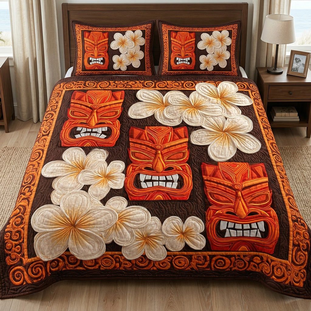 Tiki Plumeria quilted 3-piece bedding set on a made bed with two matching pillow shams