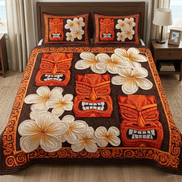Tiki Plumeria quilted 3-piece bedding set on a made bed with two matching pillow shams