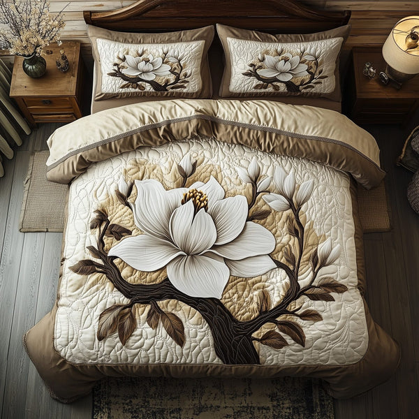 Timeless Magnolia Beauty quilted 3-piece bedding set on a made bed in a farmhouse bedroom