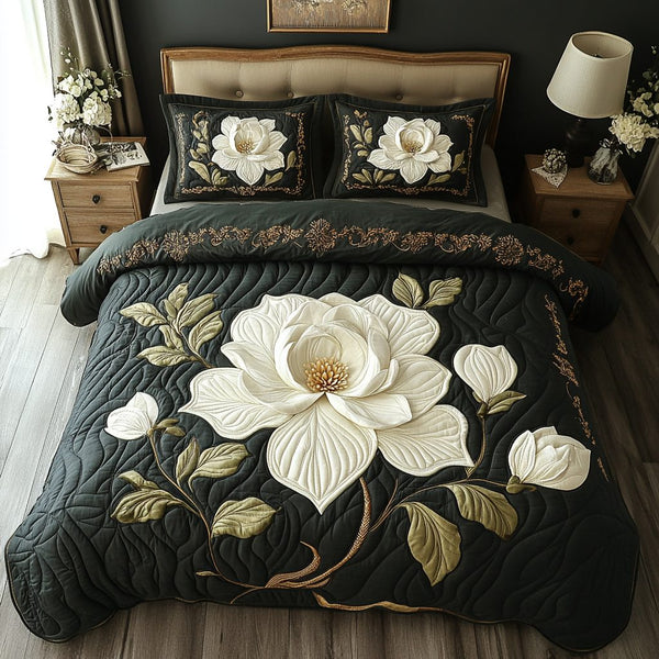 Timeless Magnolia quilted 3-piece bedding set on a made bed in a farmhouse bedroom