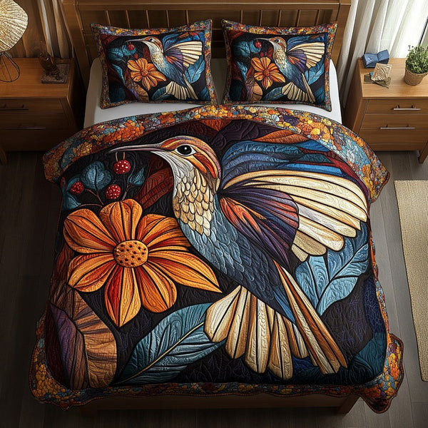 Tiny Jewel quilted 3-piece bedding set on a made bed with two matching pillow shams