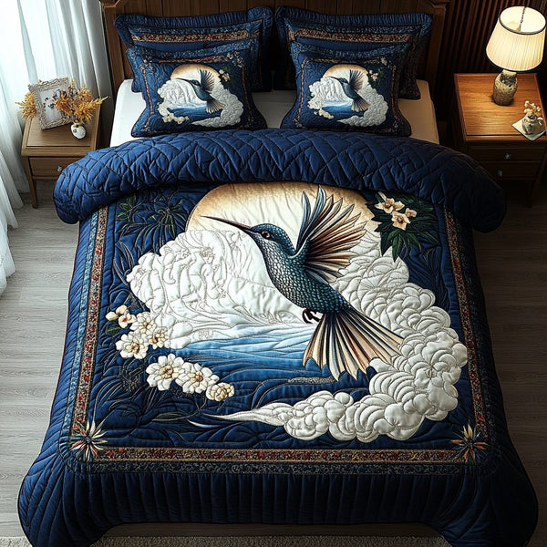 Tiny Wonder quilted 3-piece bedding set on a made bed with two matching pillow shams