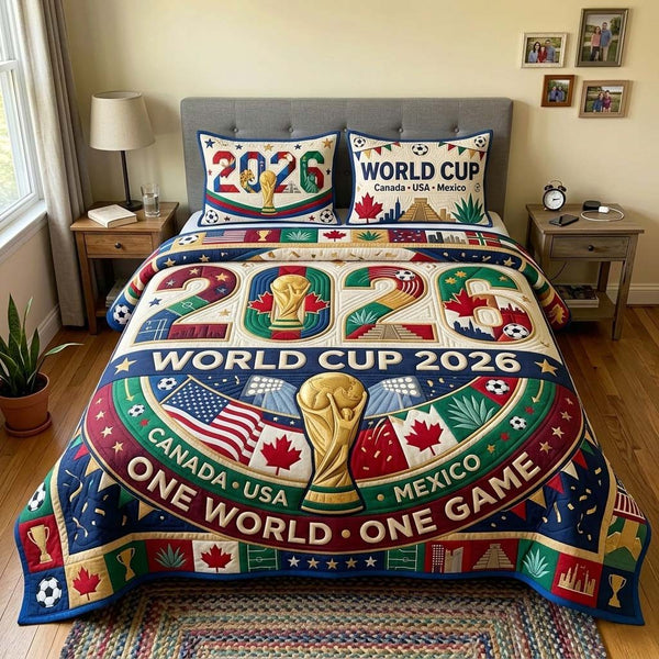 Tournament Unity quilted 3-piece bedding set on a made bed with two matching pillow shams