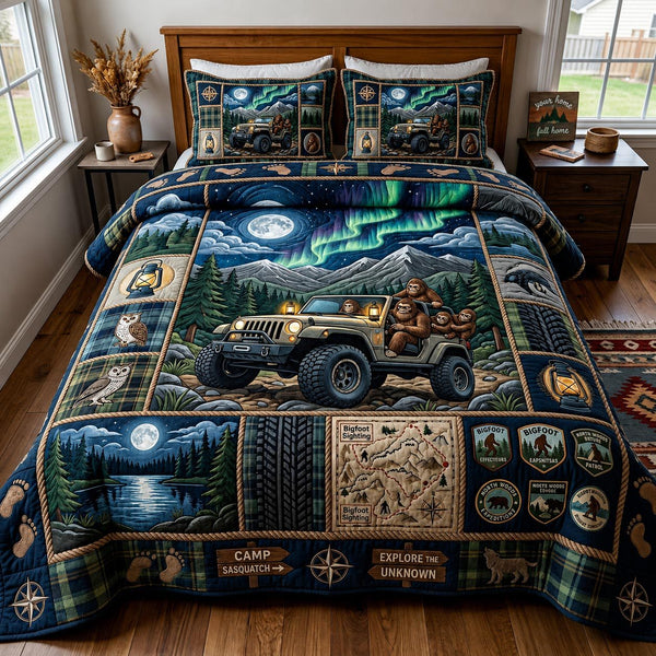 Trail Squatch quilted 3-piece bedding set on a made bed with two matching pillow shams
