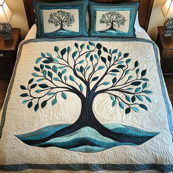 Tranquil Forest quilted 3-piece bedding set on a made bed with two matching pillow shams