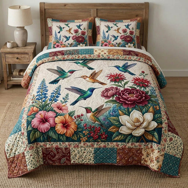 Tranquil Grove quilted 3-piece bedding set on a made bed with two matching pillow shams
