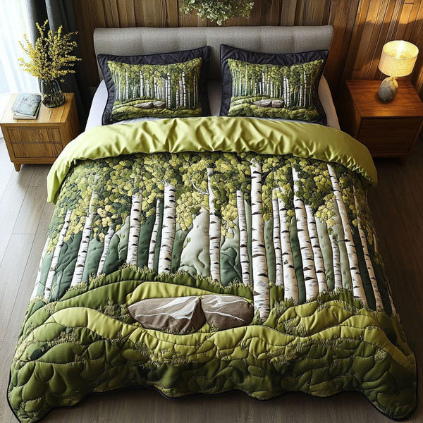 Tranquil Grove quilted 3-piece bedding set on a made bed with two matching pillow shams