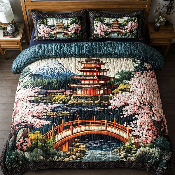 Tranquil Pagoda quilted 3-piece bedding set on a made bed with two matching pillow shams