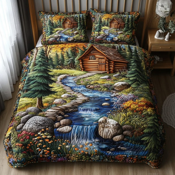 Tranquil Pines quilted 3-piece bedding set on a made bed with two matching pillow shams