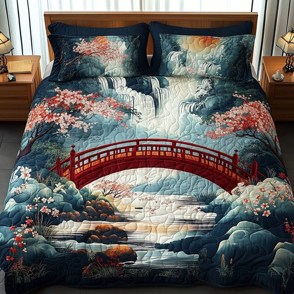 Tranquil Sakura quilted 3-piece bedding set on a made bed with two matching pillow shams