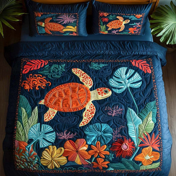 Tranquil Sea quilted 3-piece bedding set on a made bed in a light coastal bedroom