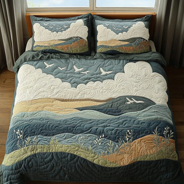 Tranquil Waves quilted 3-piece bedding set on a made bed in a light coastal bedroom