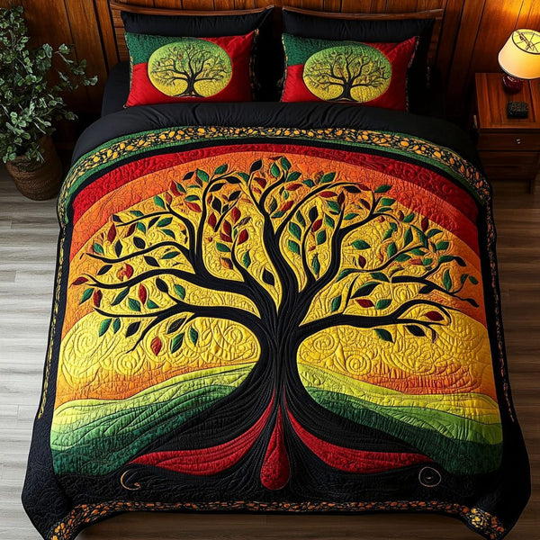 Tree of Empowerment quilted 3-piece bedding set on a made bed with two matching pillow shams