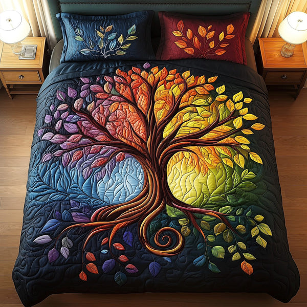 Tree of Harmony quilted 3-piece bedding set on a made bed with two matching pillow shams