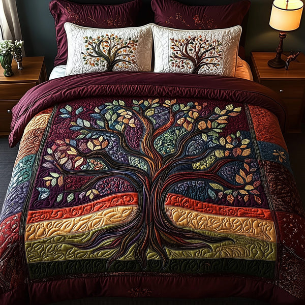 Tree Of Life quilted 3-piece bedding set on a made bed with two matching pillow shams