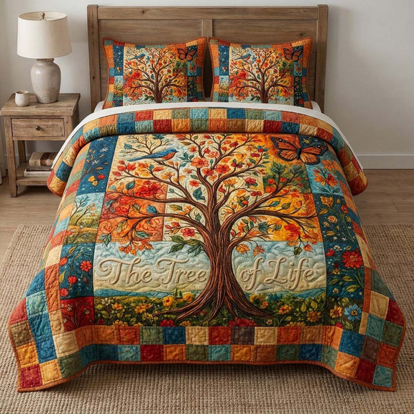 Tree Of Life quilted 3-piece bedding set on a made bed with two matching pillow shams