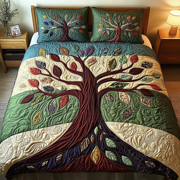 Tree of Life quilted 3-piece bedding set on a made bed with two matching pillow shams