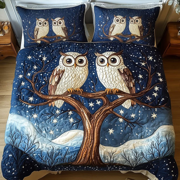 Tree Owls quilted 3-piece bedding set on a made bed with two matching pillow shams