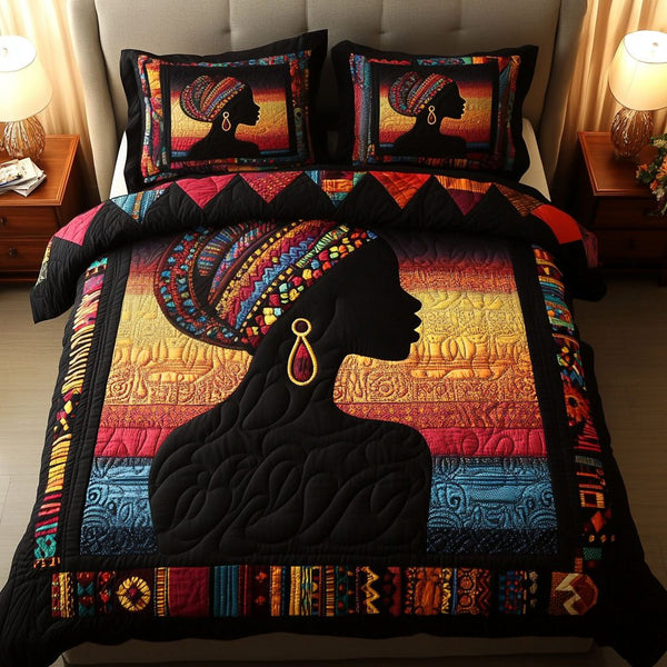 Tribal Beauty quilted 3-piece bedding set on a made bed with two matching pillow shams