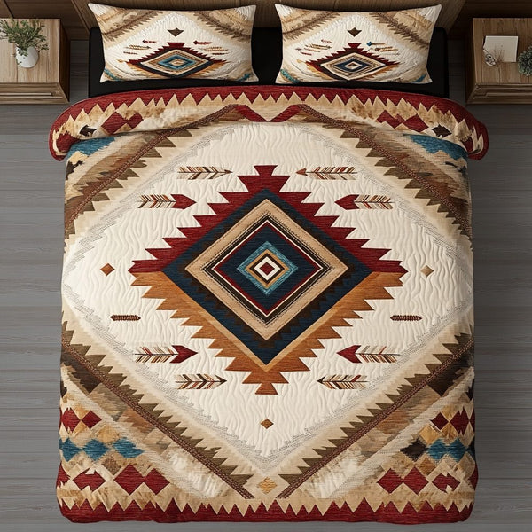 Tribal Echo quilted 3-piece bedding set on a made bed with two matching pillow shams