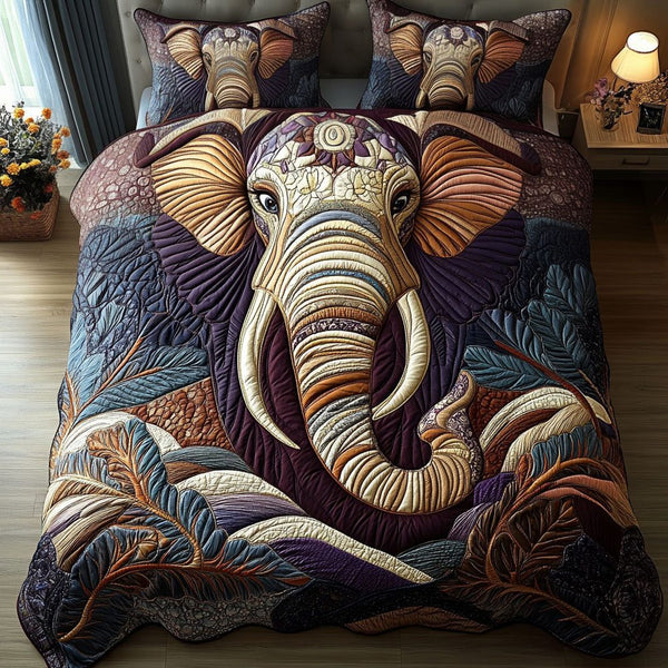 Tribal Elephant Bliss quilted 3-piece bedding set on a made bed with two matching pillow shams
