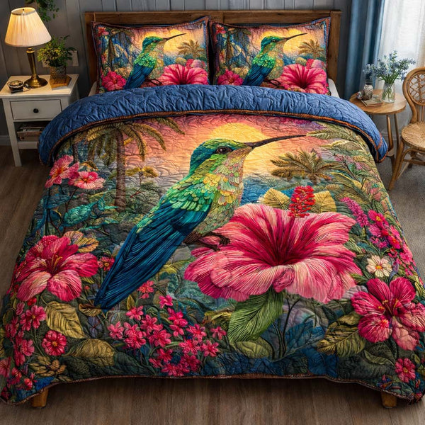 Tropical Bloom Hummingbird quilted 3-piece bedding set on a made bed in a light coastal bedroom