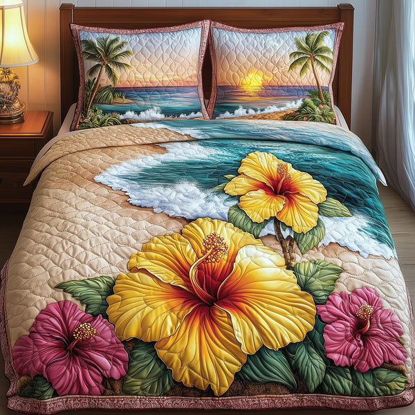 Tropical Blooming quilted 3-piece bedding set on a made bed in a light coastal bedroom