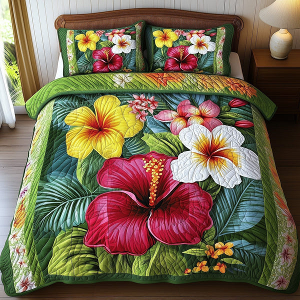 Tropical Blooming quilted 3-piece bedding set on a made bed in a light coastal bedroom