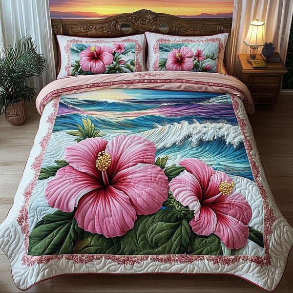 Tropical Blooming quilted 3-piece bedding set on a made bed in a light coastal bedroom